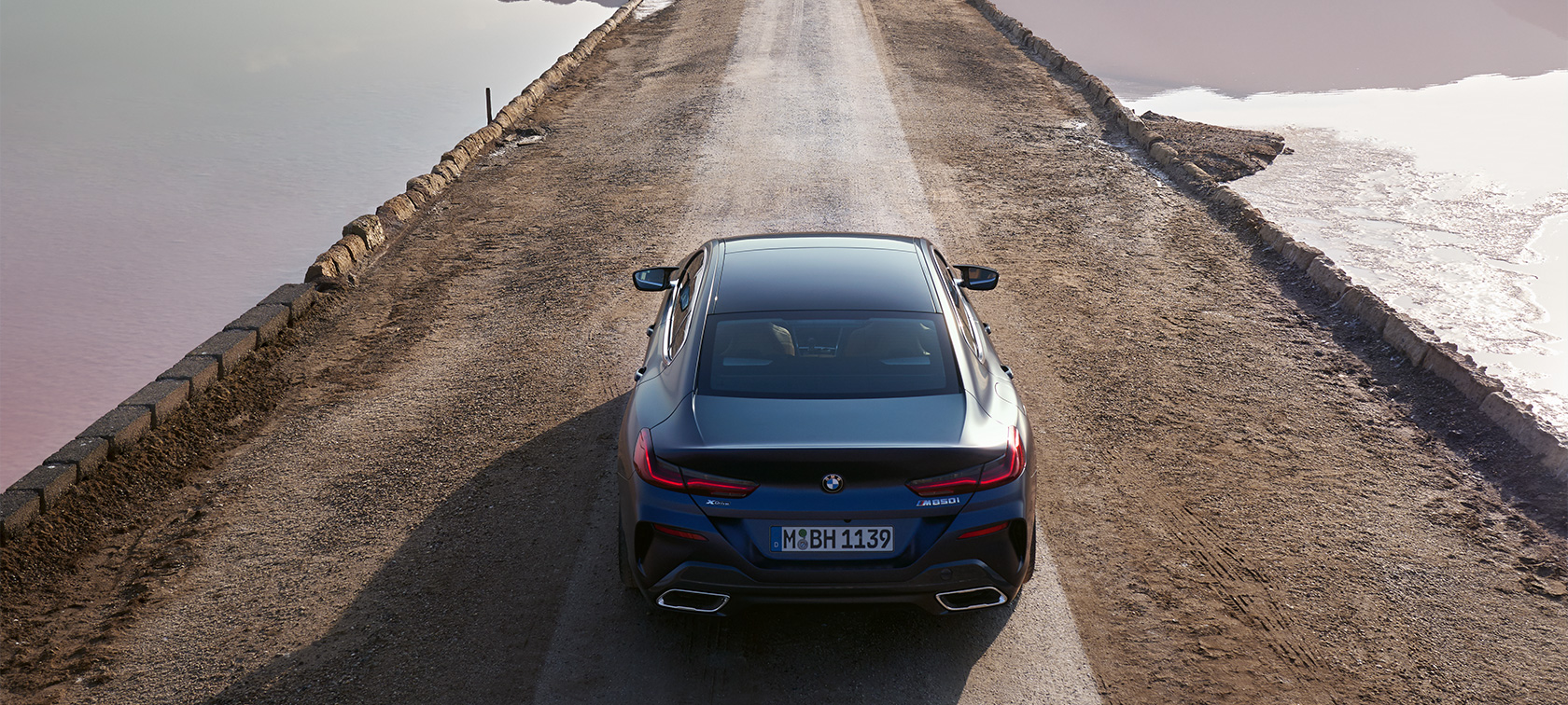 BMW M850i xDrive Gran Coupé G16 LCI Facelift 2022 BMW Individual Frozen Tanzanite Blue metallic rear from bird’s eye view